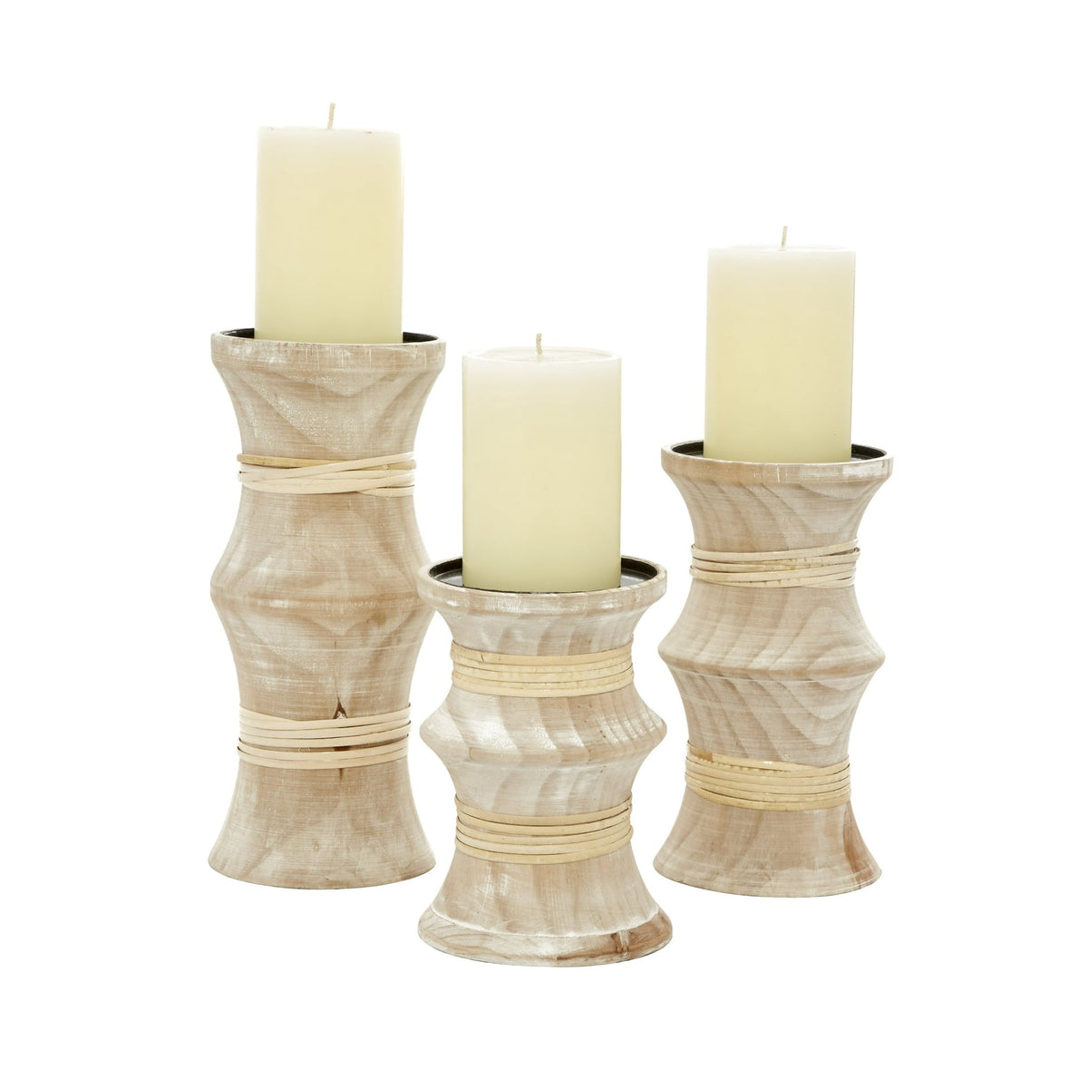 A set of three wooden candle stands with a natural beige finish, each of different heights, wrapped with strips of rattan.