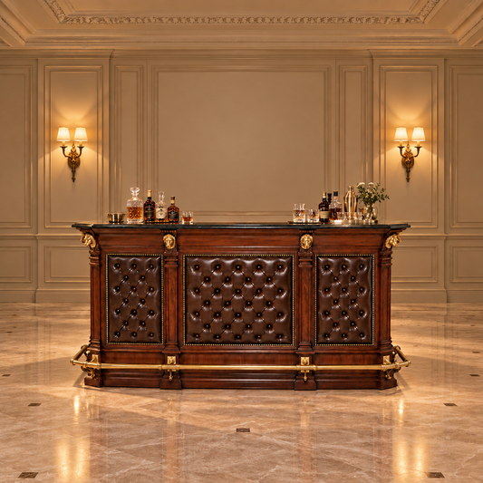 An ornate bar counter with dark brown tufted leather panels and gold-tone hardware, set against a classic beige paneled wall with sconces and a polished marble floor.