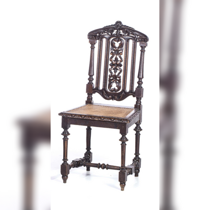 Decorative wooden chair with intricate carvings on a white background