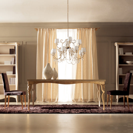 Dining room with a chandelier, table, chairs, and decorative vases.