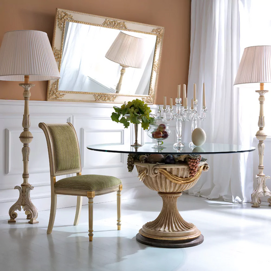 Dining room with ornate table, chair, and decorative elements.