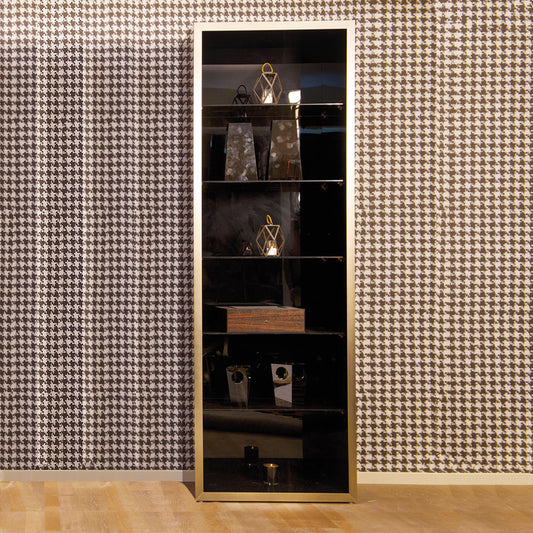 A tall mahogany veneer display cabinet with antique gold accents, glass shelves, and items displayed inside, standing against a houndstooth wallpaper background.